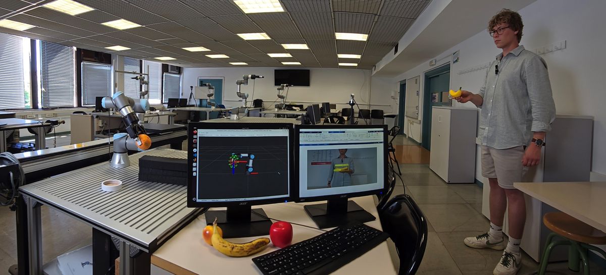 Students working with a Universal Robots cobot in a university laboratory